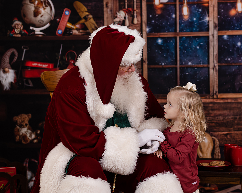 little girl looking at santa