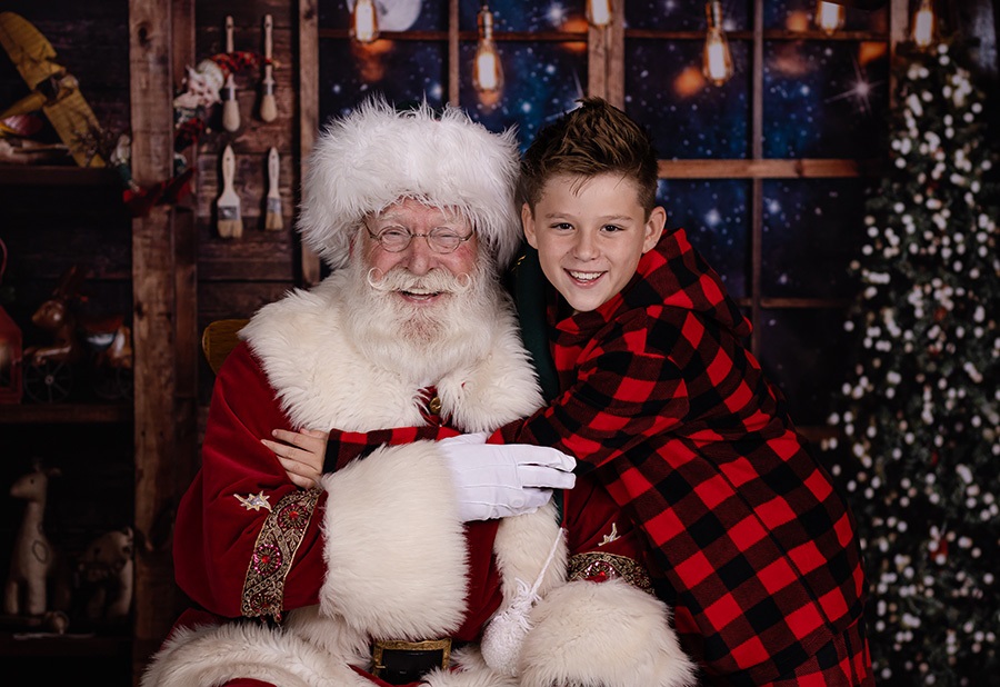 boy hugging santa claus