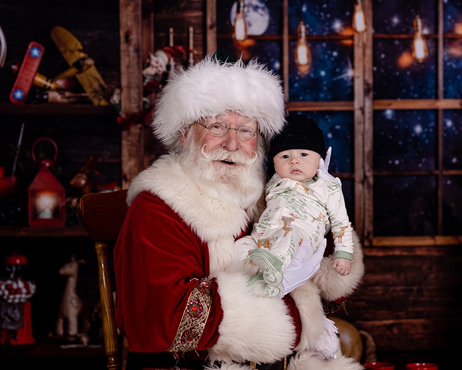 baby held by santa claus